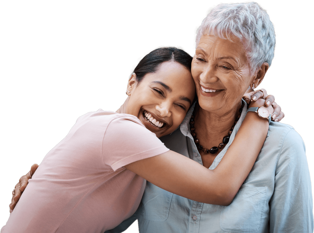 younger woman hugging older woman 
