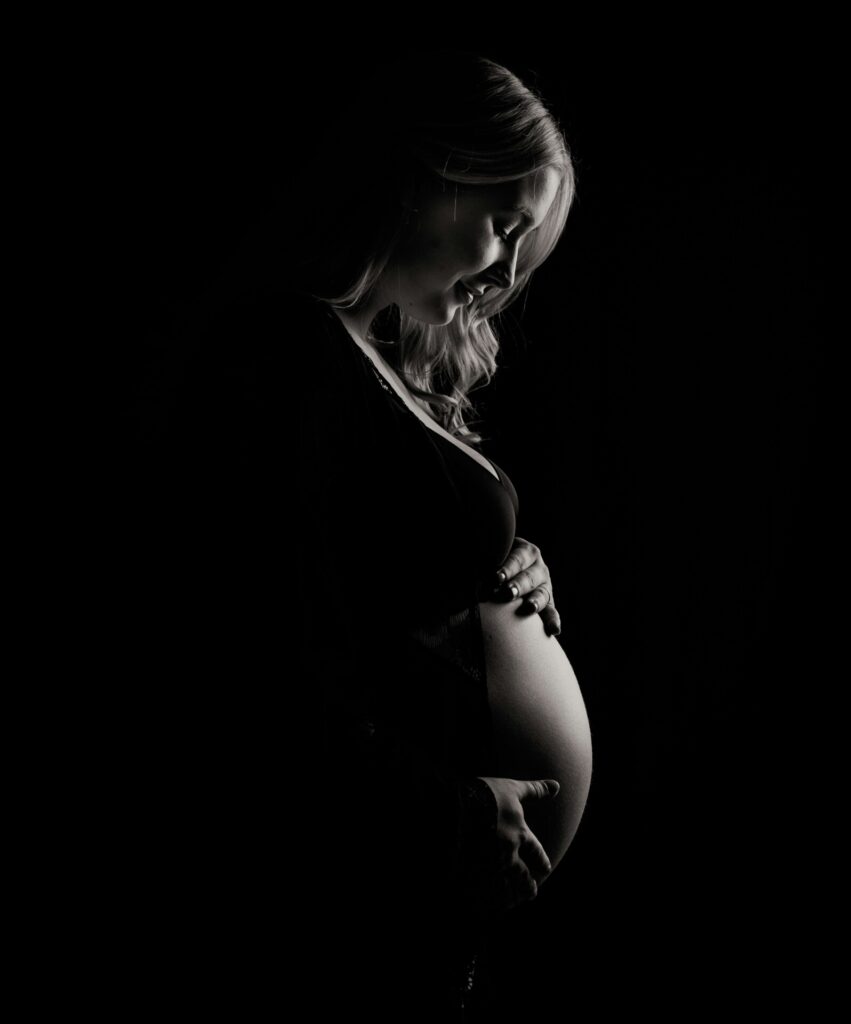 pregnant woman in the shadows
